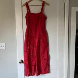 Red orange jumpsuit with back cutout and leg slit